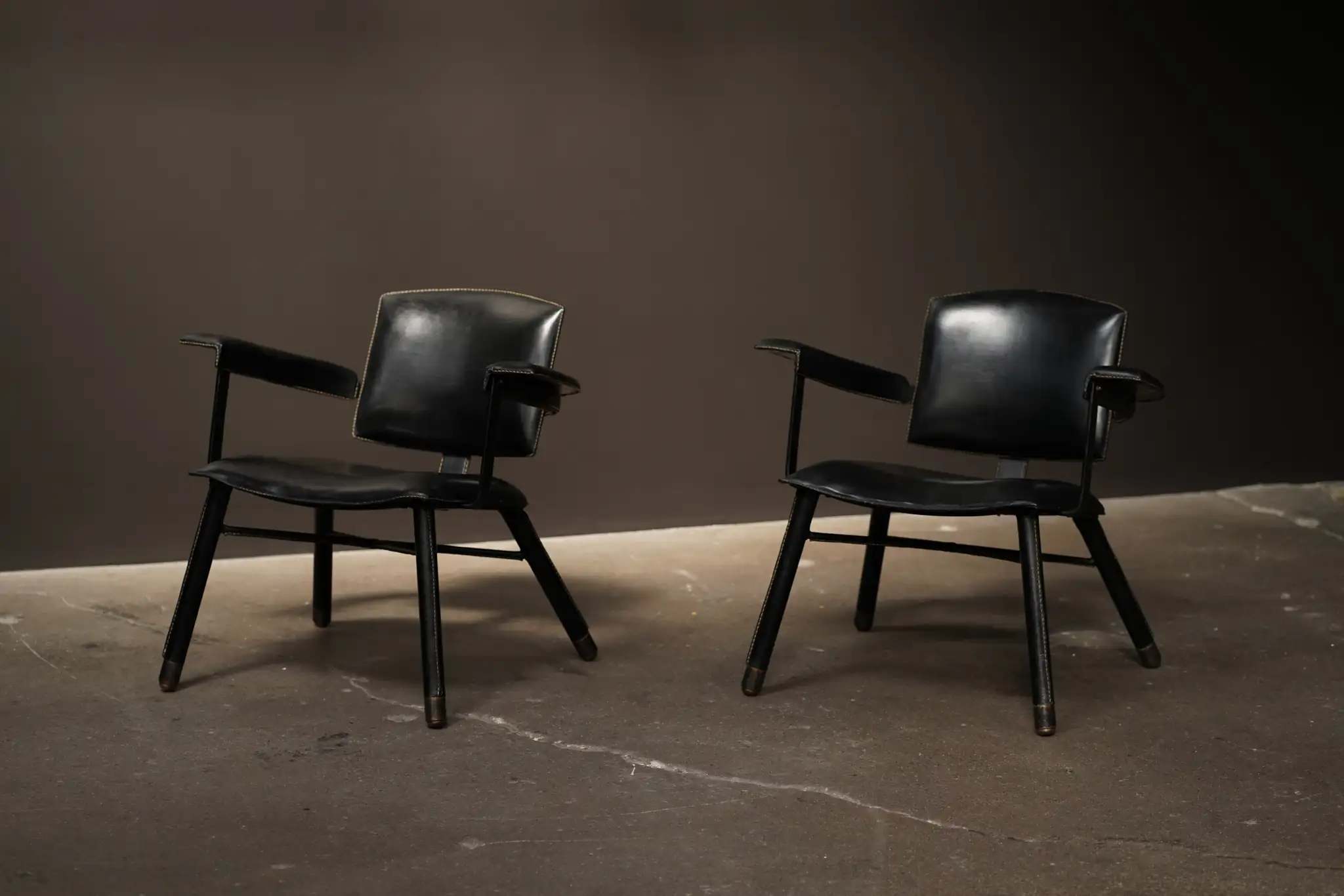 Jaques Adnet Low Arm Chairs, C1950.