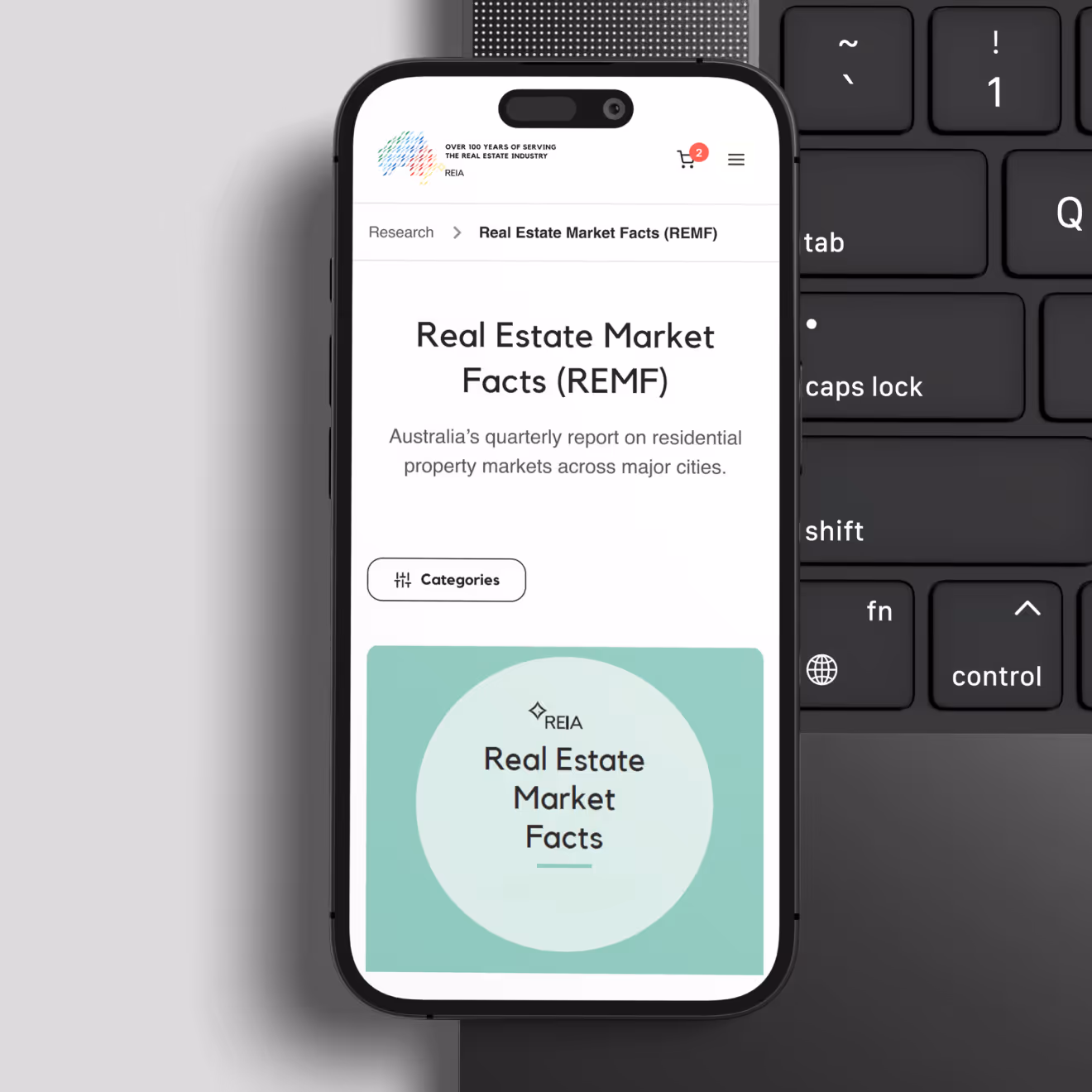 Smartphone displaying a webpage titled Real Estate Market Facts (REMF) with a subtitle about Australia's quarterly report on residential property markets.