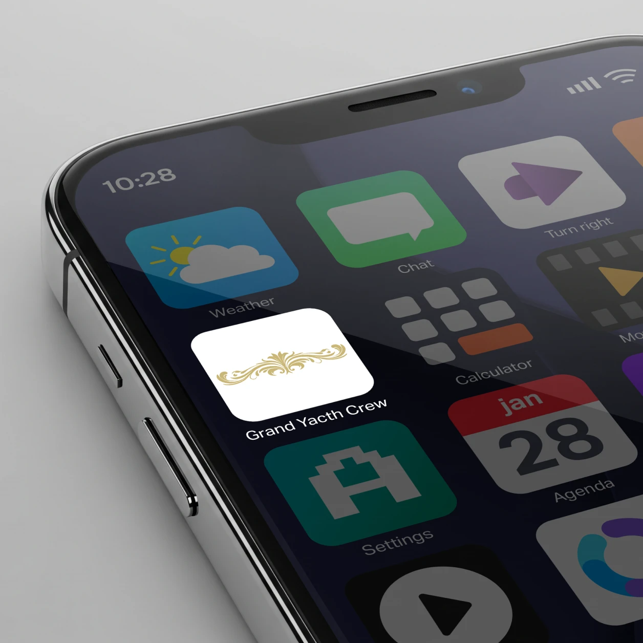 Smartphone screen showing a Grand Yacht Crew app icon with a gold ornamental design on white background.