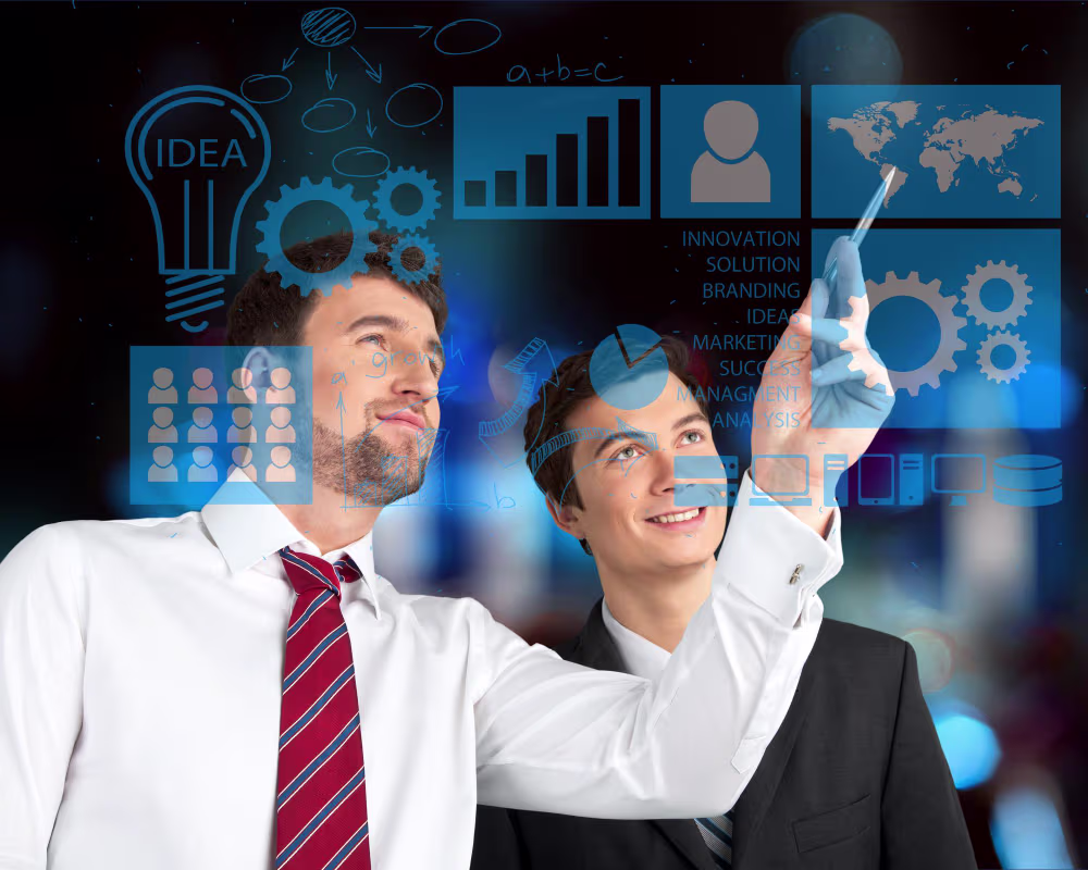 A Senior NetSuite Technical Consultant mentoring a younger NetSuite Technical Consultant through graphs, charts, and infographics.