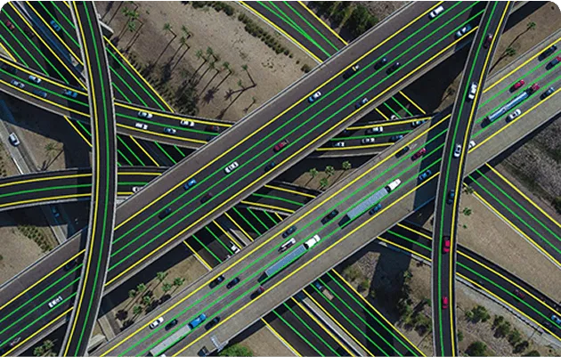 Aerial highway interchange with roads and lanes marked for infrastructure mapping.