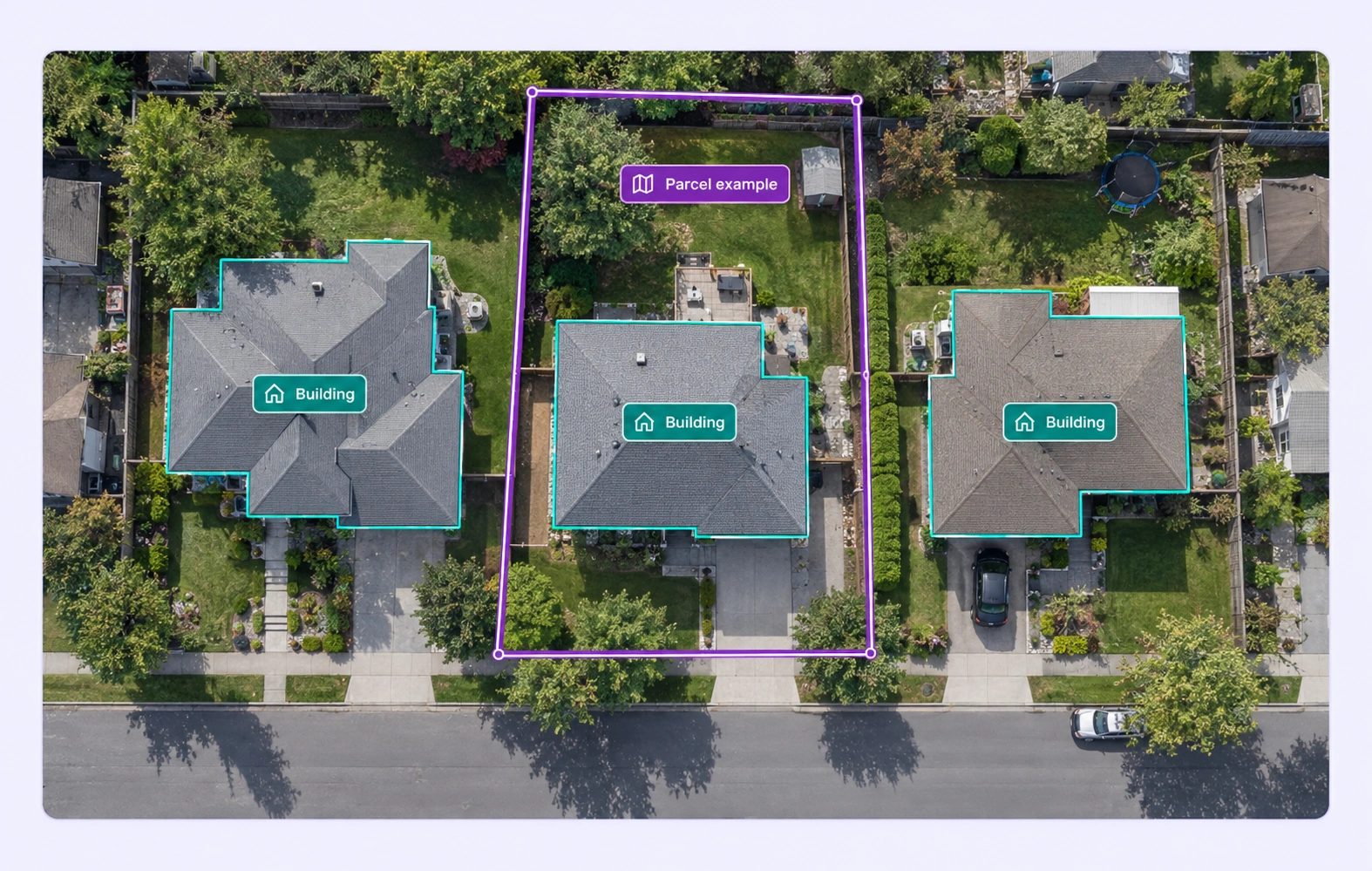Aerial buildings and a visible parcel example outlined with polygons. Aerial buildings and a visible parcel example outlined with polygons.