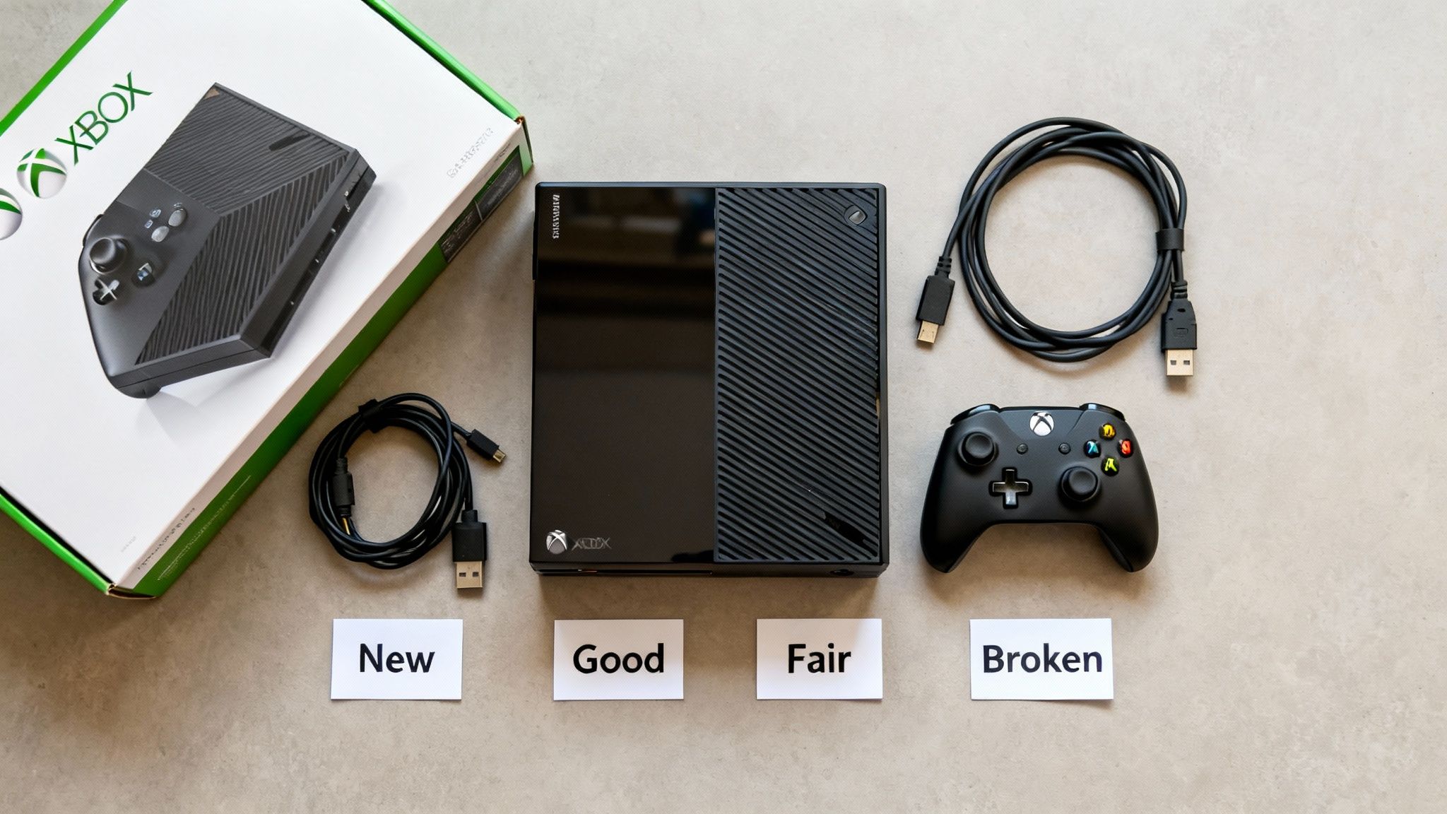 Various Xbox console items and accessories, including a boxed console, loose console, cables, and controller, labeled by condition.