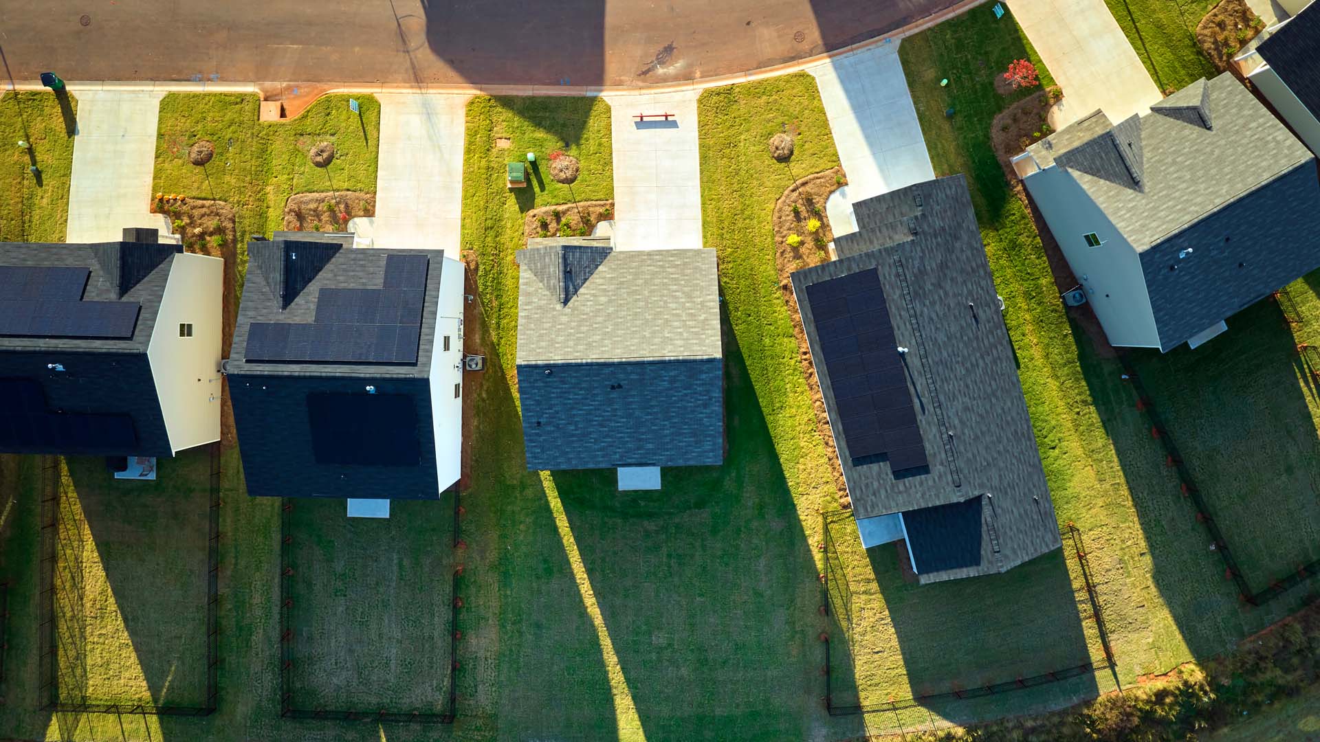 A Drone photo of a group of homes with solar panels installed