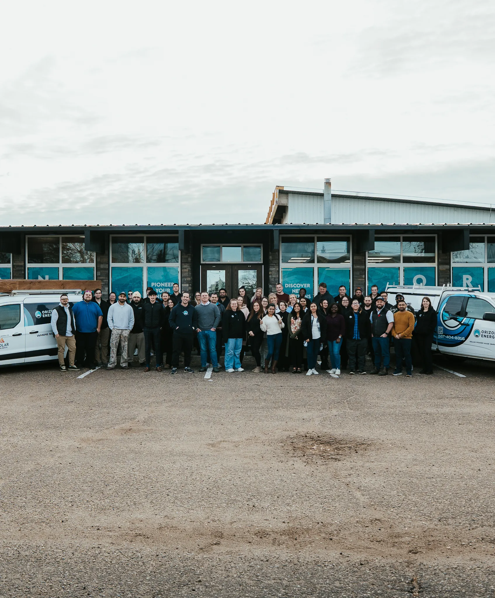The Orizon Energy team posing for a photo in front of their Edmonton headquarters