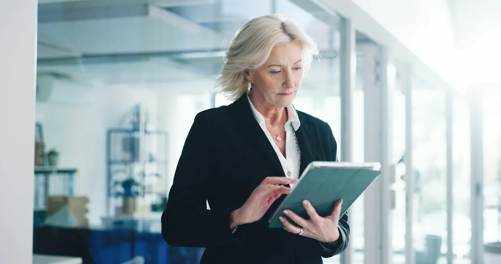 office-employee-and-mature-woman-with-tablet-realtor-and-browse-listing-on-website-or-real-estate-online-broker-and-person-with-tech-for-property-research-scroll-and-planning-for-virtual-tour