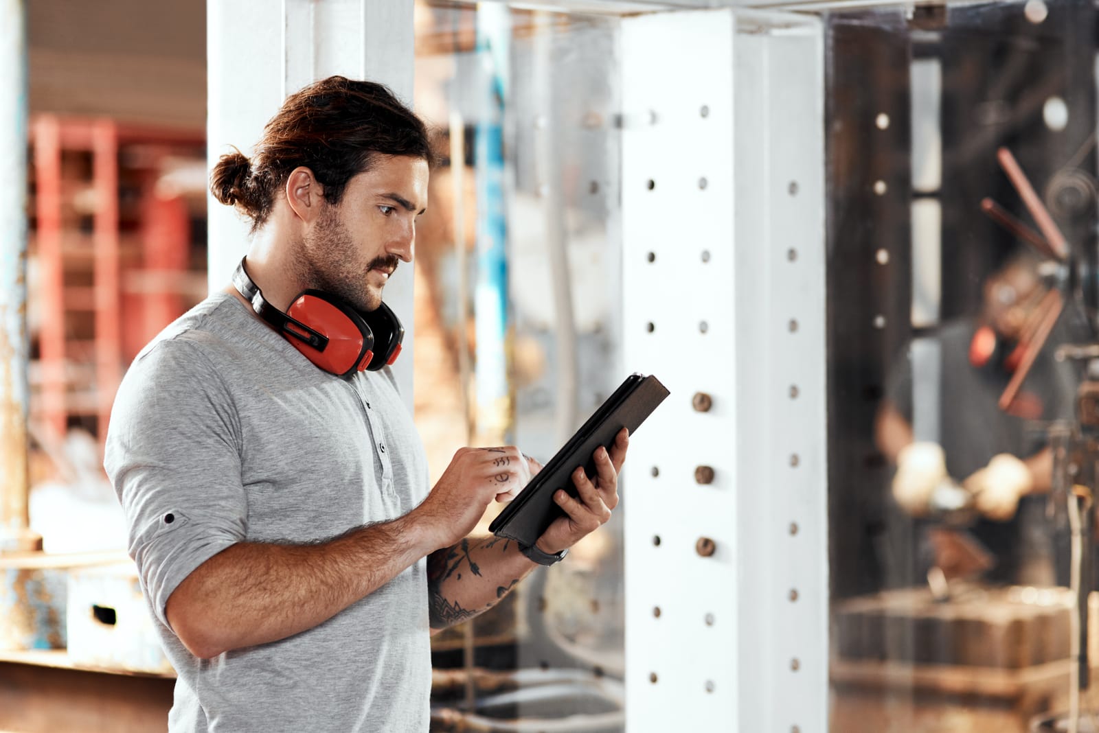 man-in-workshop-for-blacksmith-planning-or-blue-collar-trade-in-small-business-startup-research-and-metal-worker-in-factory-on-technology-for-production-or-steel-industry
