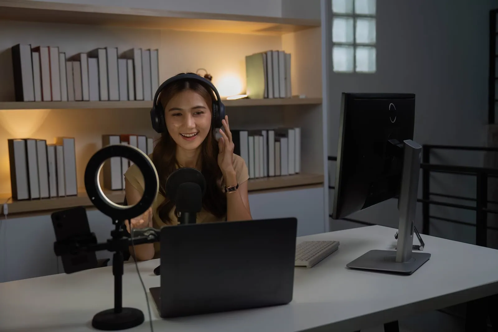 Future of work and digital interaction young woman smiling while streaming