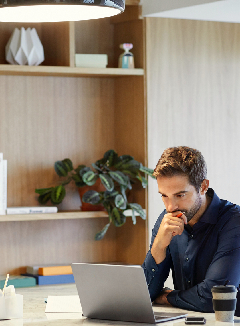 Man working at wooden desk