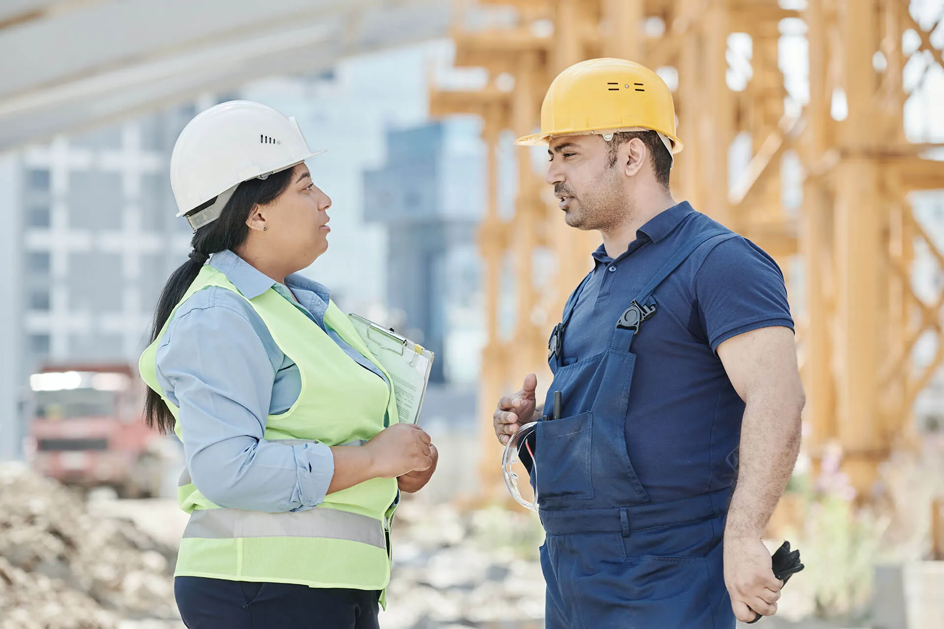 a man and a woman wearing hard hats