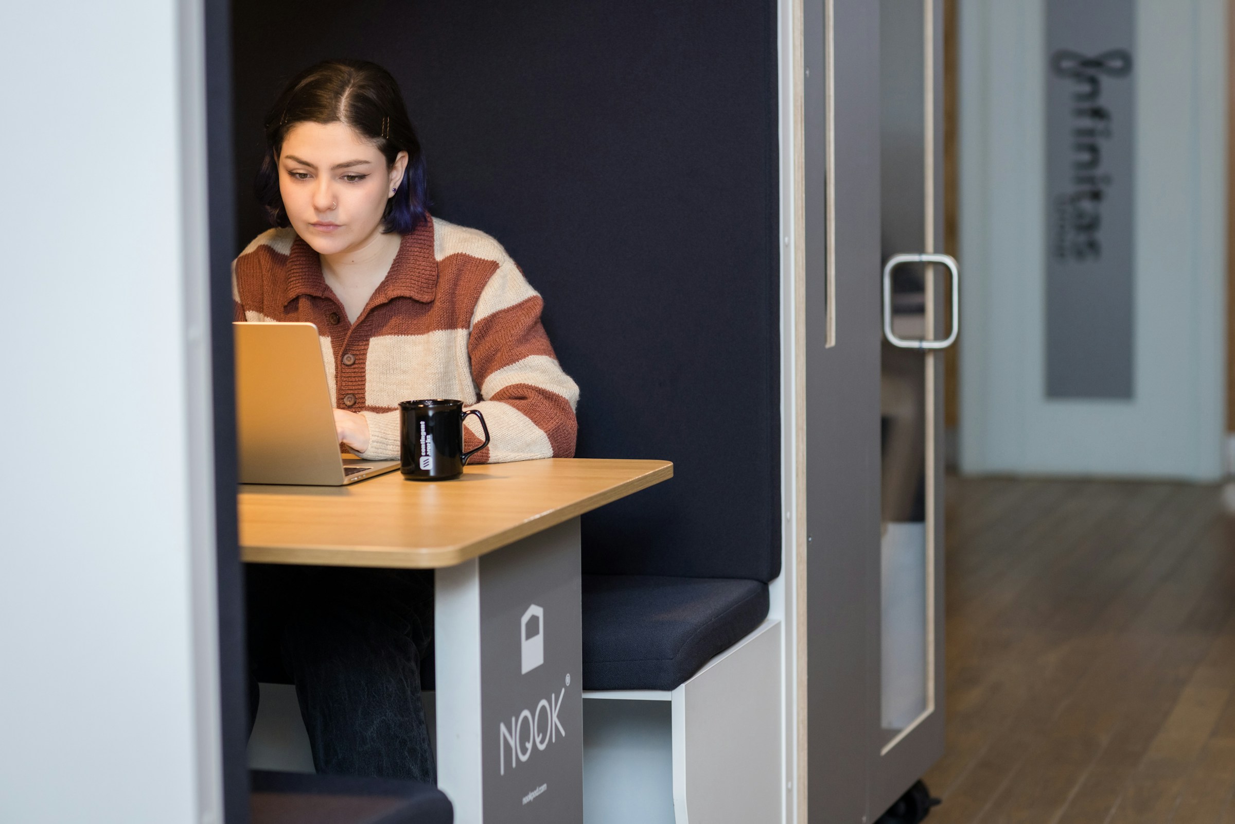 woman using a laptop in an office - Opus Clip