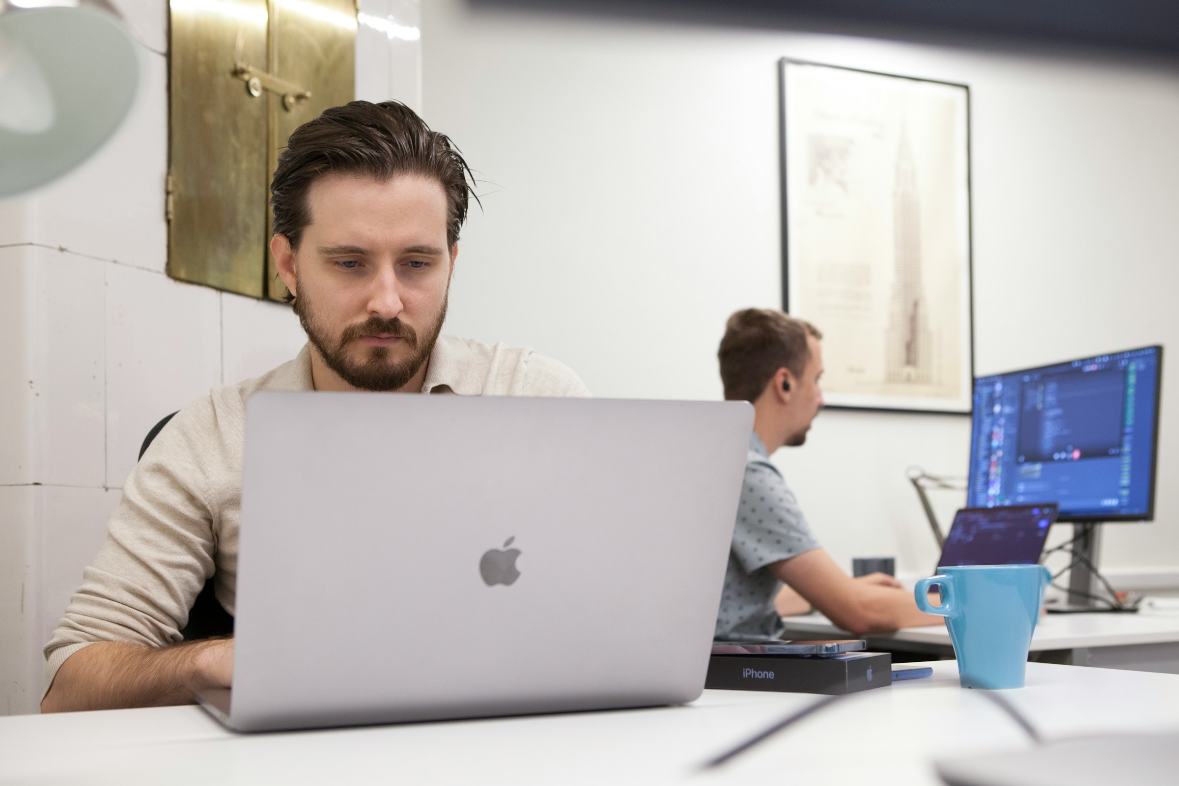 man using a macbook - Opus Clip