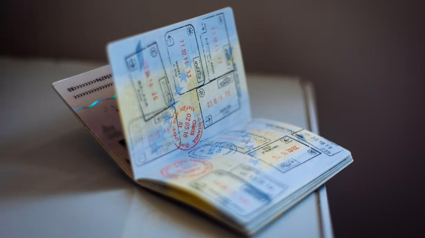 Open passport with entry and exit stamps – symbolizing the digital product passport as the “identity” of appliances, documenting their sustainability journey.