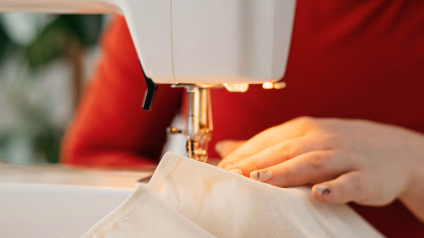 Clothes are being sewn with a sewing machine.