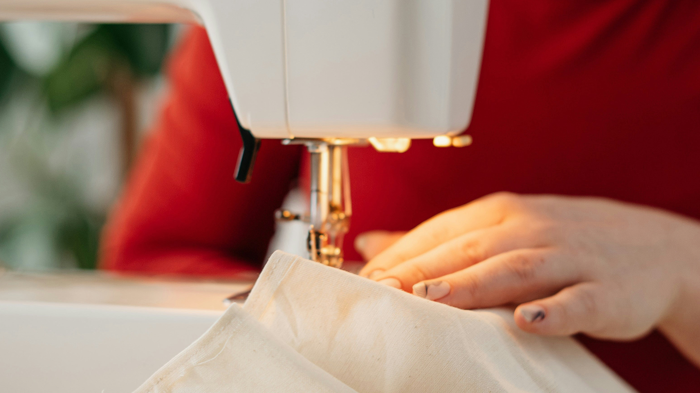 Clothes are being sewn with a sewing machine.