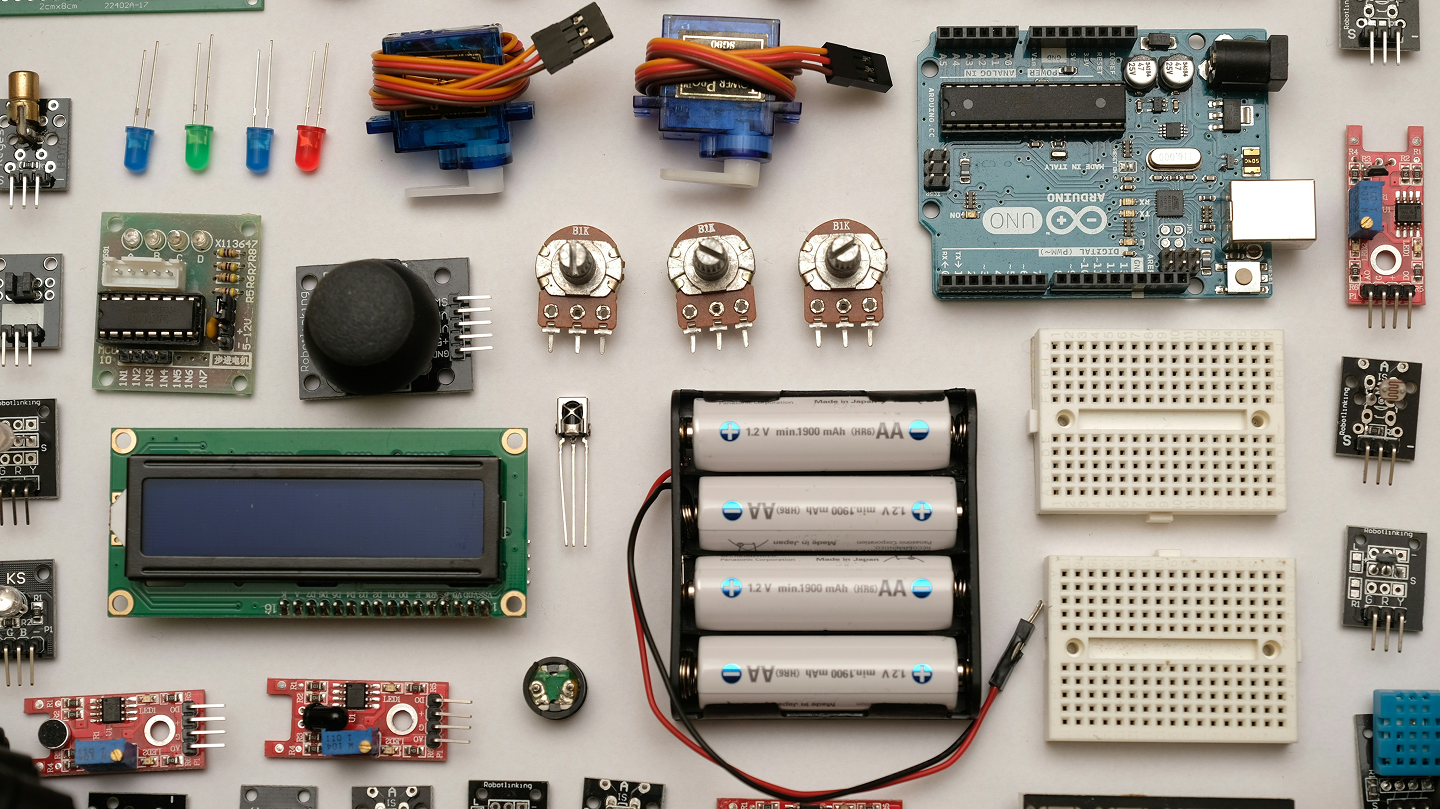 Different spare parts are laid out side by side.