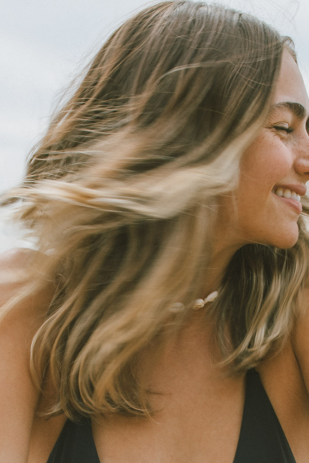 Smiling woman with windswept hair