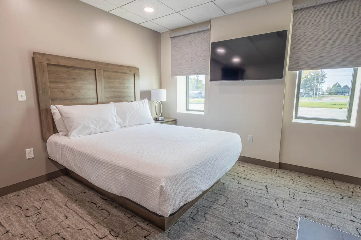 queen bed with flatscreen tv