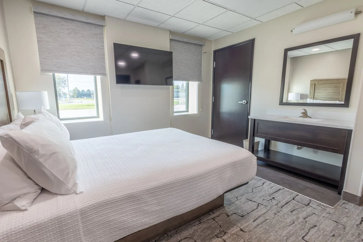 queen room with vanity