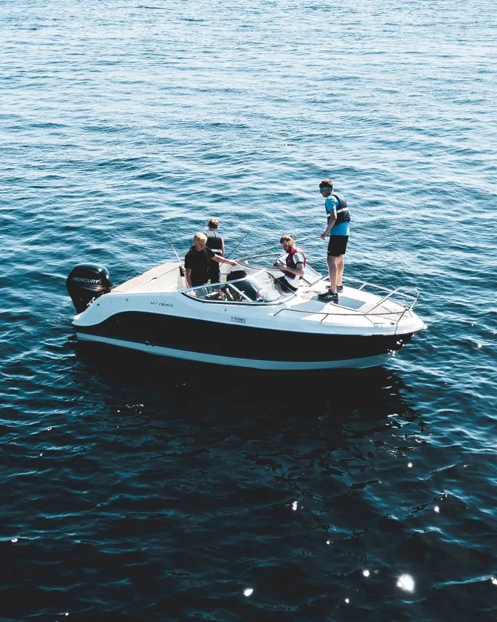 people on boat in lake