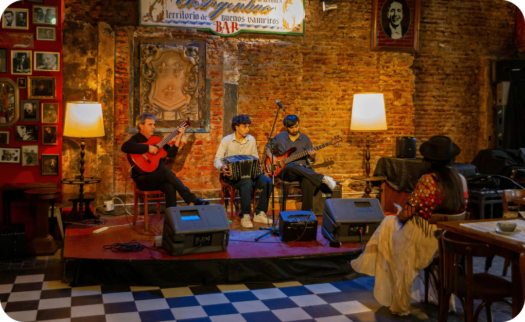 three guys playing live in a room