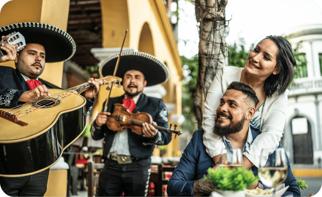 couple listening to mariachi band