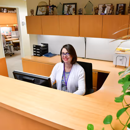 Smiling staff member from the administration section