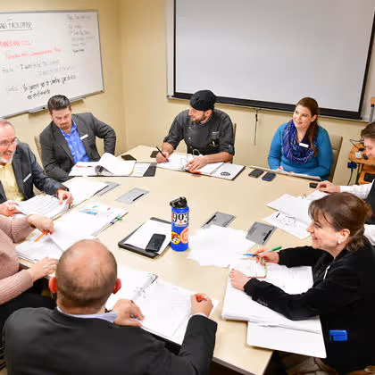 Management staff meeting in a room