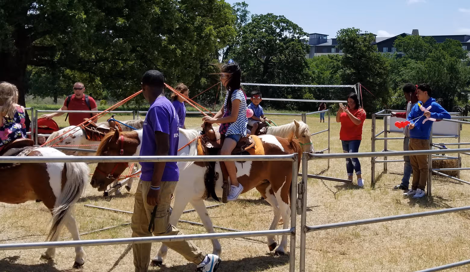 team members riding horses