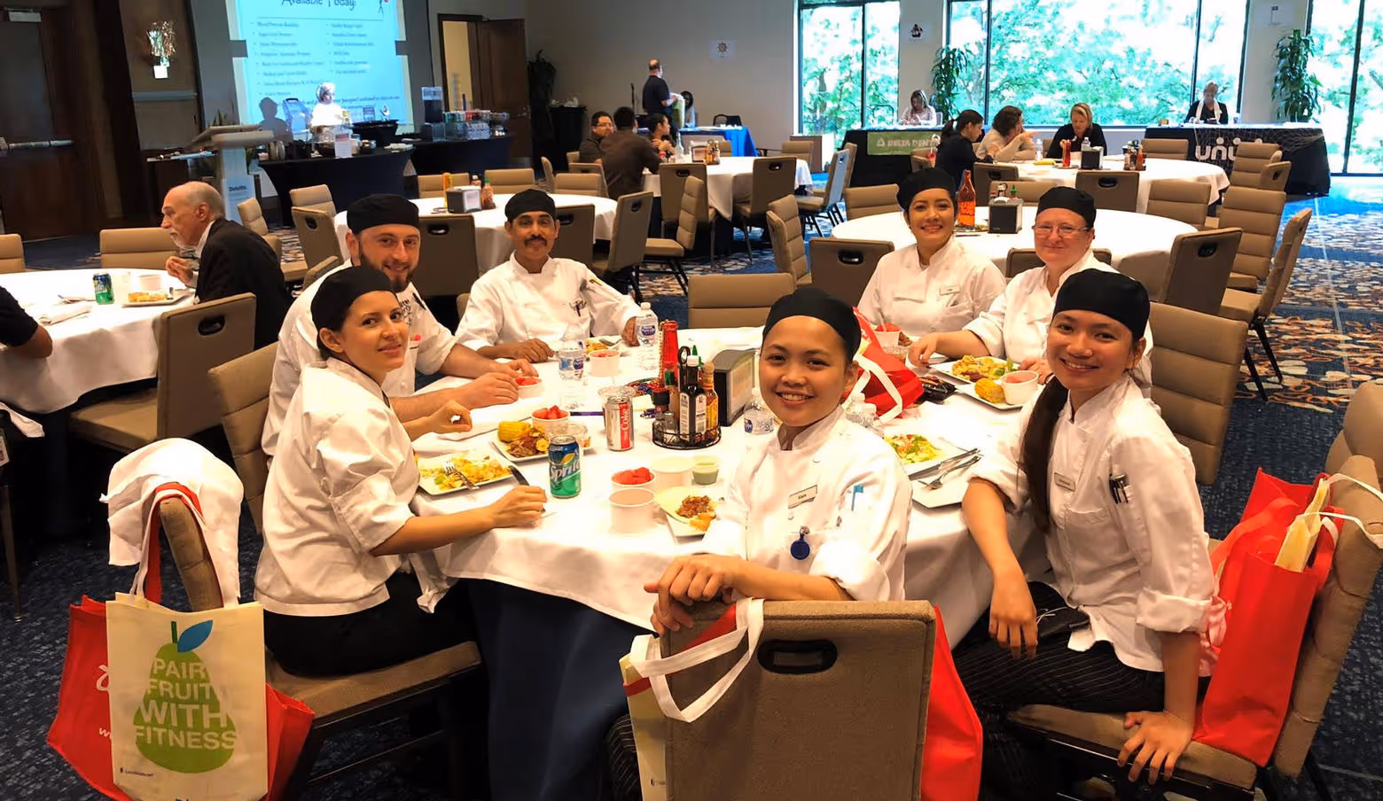 culinary team sitting together at round table