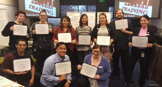 team members in a training classroom