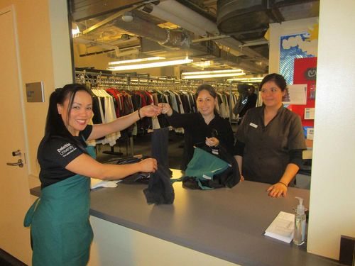 girl turning in her items