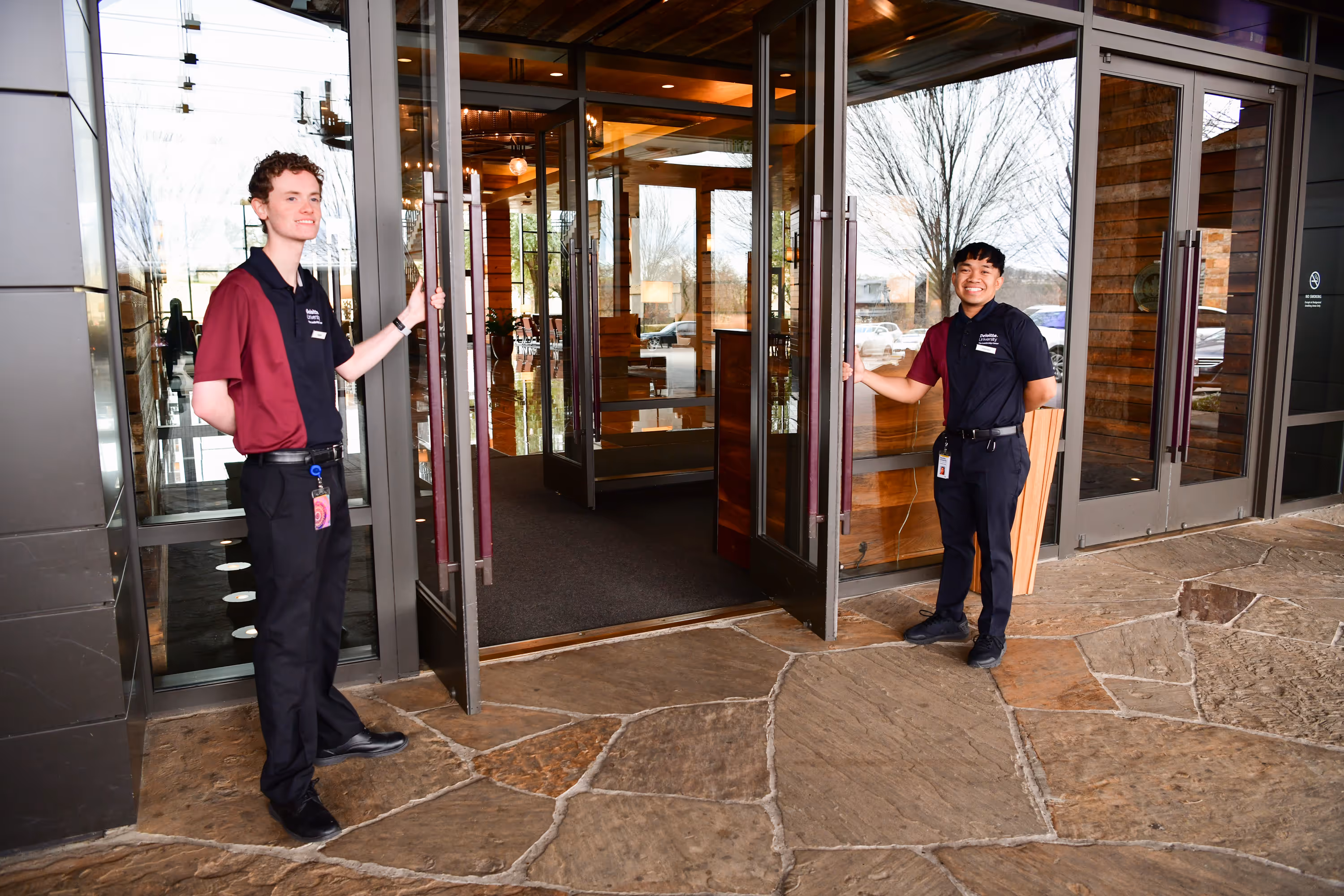 Man holding the door open for a customer
