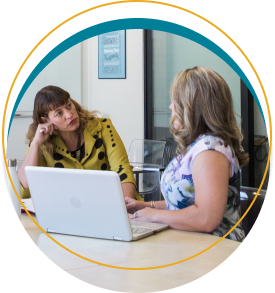 Sara and Tamsin having a private coaching session. There is a laptop open in front of Sara.