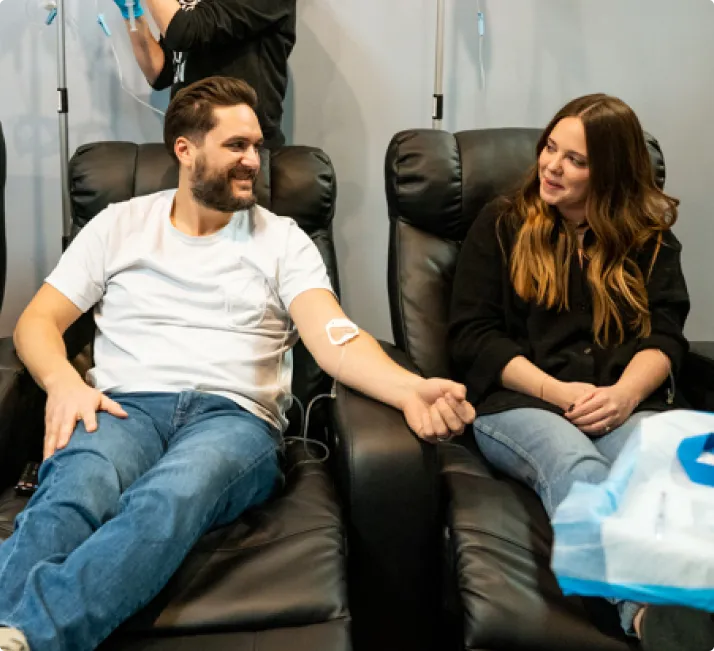 A man and woman receive IV therapy services from Iowa IV in central Iowa.