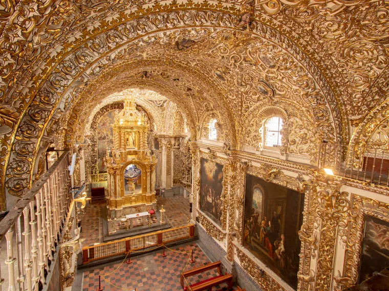 The gilded interior of the Chapel of the Rosary