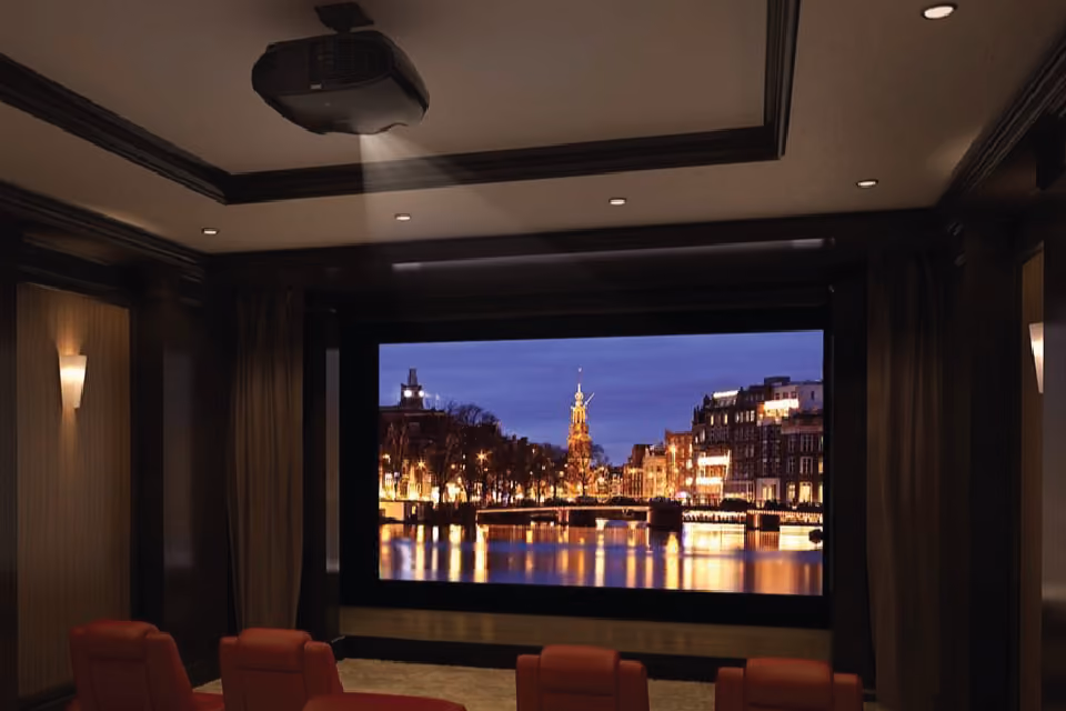 A projector being used to display images in a home cinema.