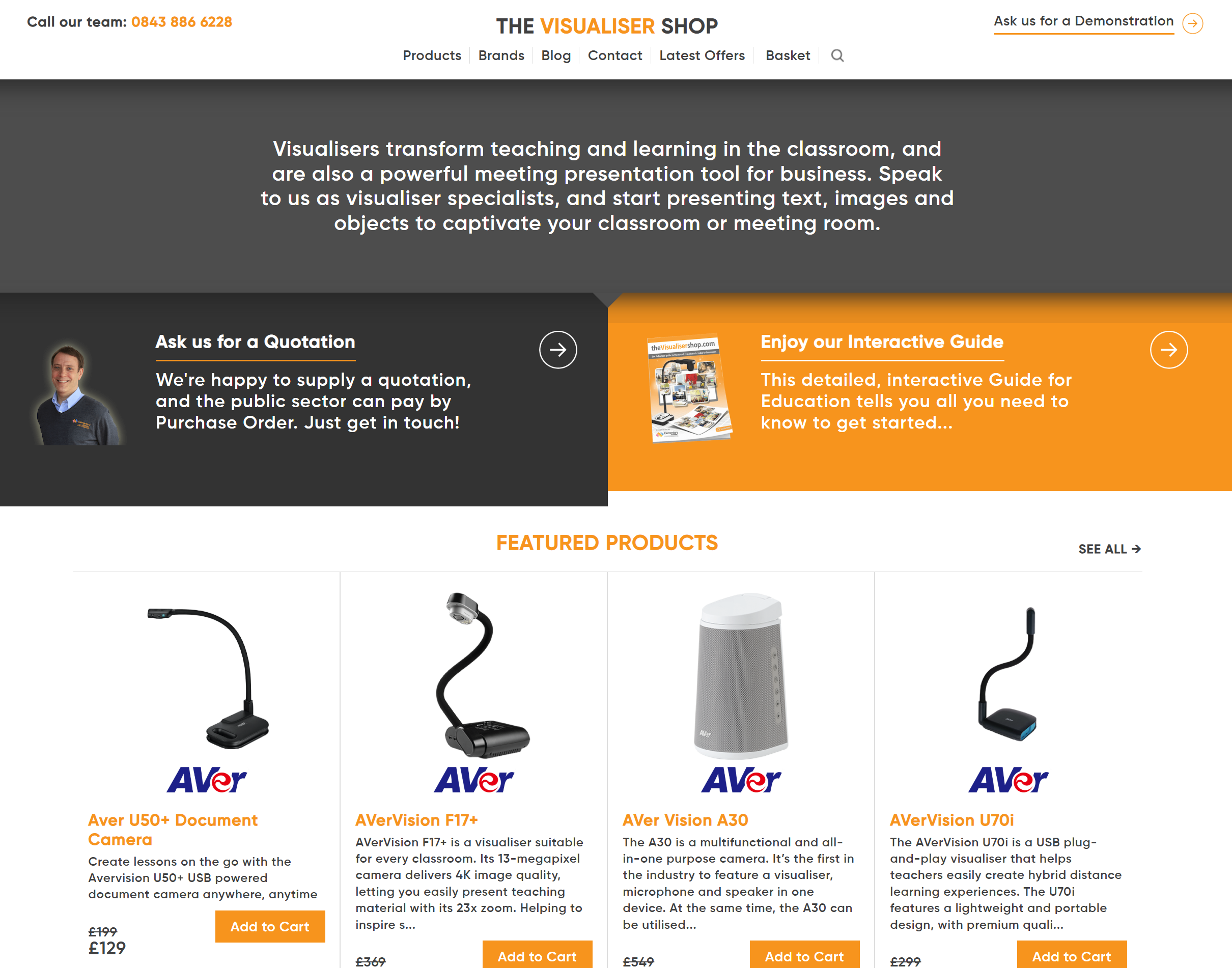 Screenshot of The Visualiser Shop website showing contact info, navigation, promotional sections, and featured AVer visualiser products with descriptions and add to cart buttons.