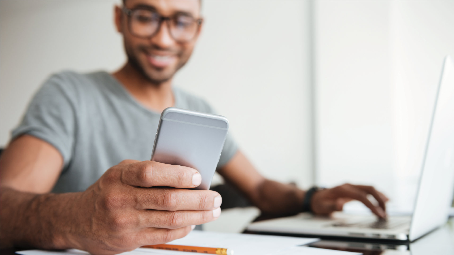 a man holding a iphone and reading a message