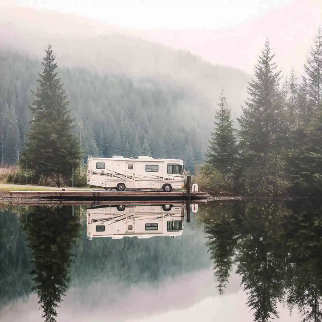 Class B RV near a private lake