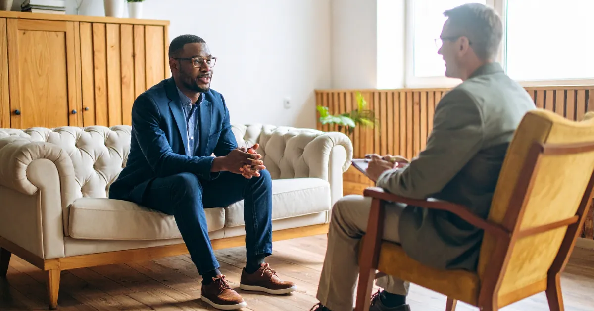 Therapist and client discussing Suboxone and fentanyl recovery options in a clinical setting.