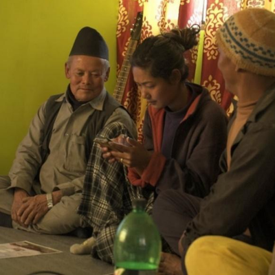 A young girl gets access to an elderly farmer’s smartphone, which she uses to follow instructions and guide him 