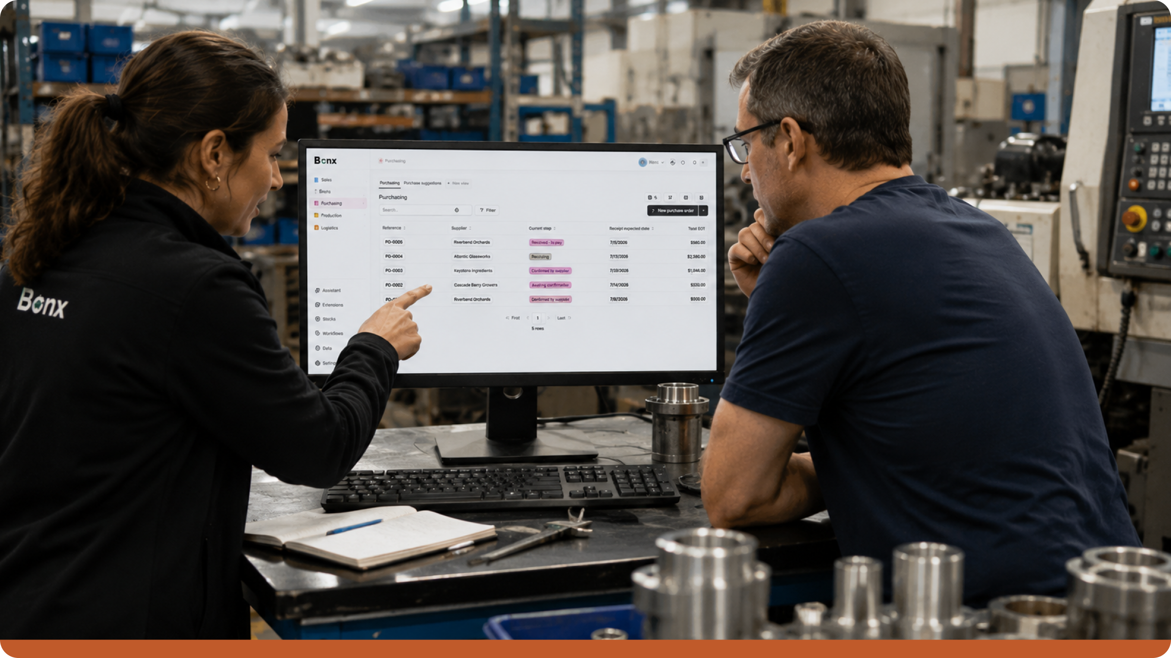 Manufacturing ERP implementation workshop showing a Bonx implementation specialist and a factory operations manager reviewing purchasing workflows in a modern CNC machining facility.