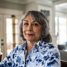 an old lady with a blue white shirt