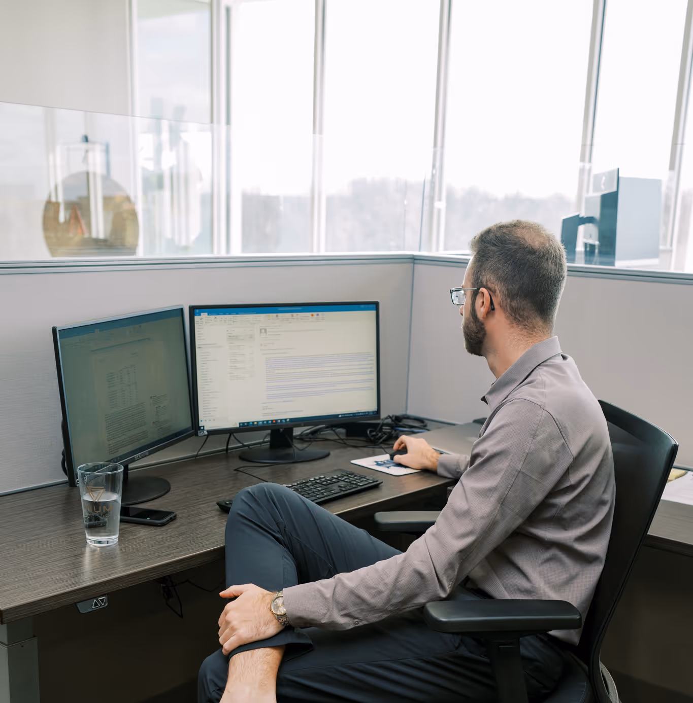 VIUM Capital working at desk, financial