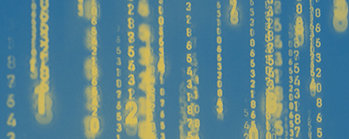 Blurred vertical columns of yellow numbers on a blue gradient background, resembling digital data streams.
