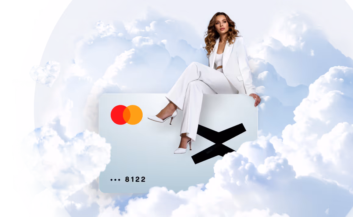 Woman dressed in white sitting on a large credit card with Mastercard logo, surrounded by fluffy clouds.