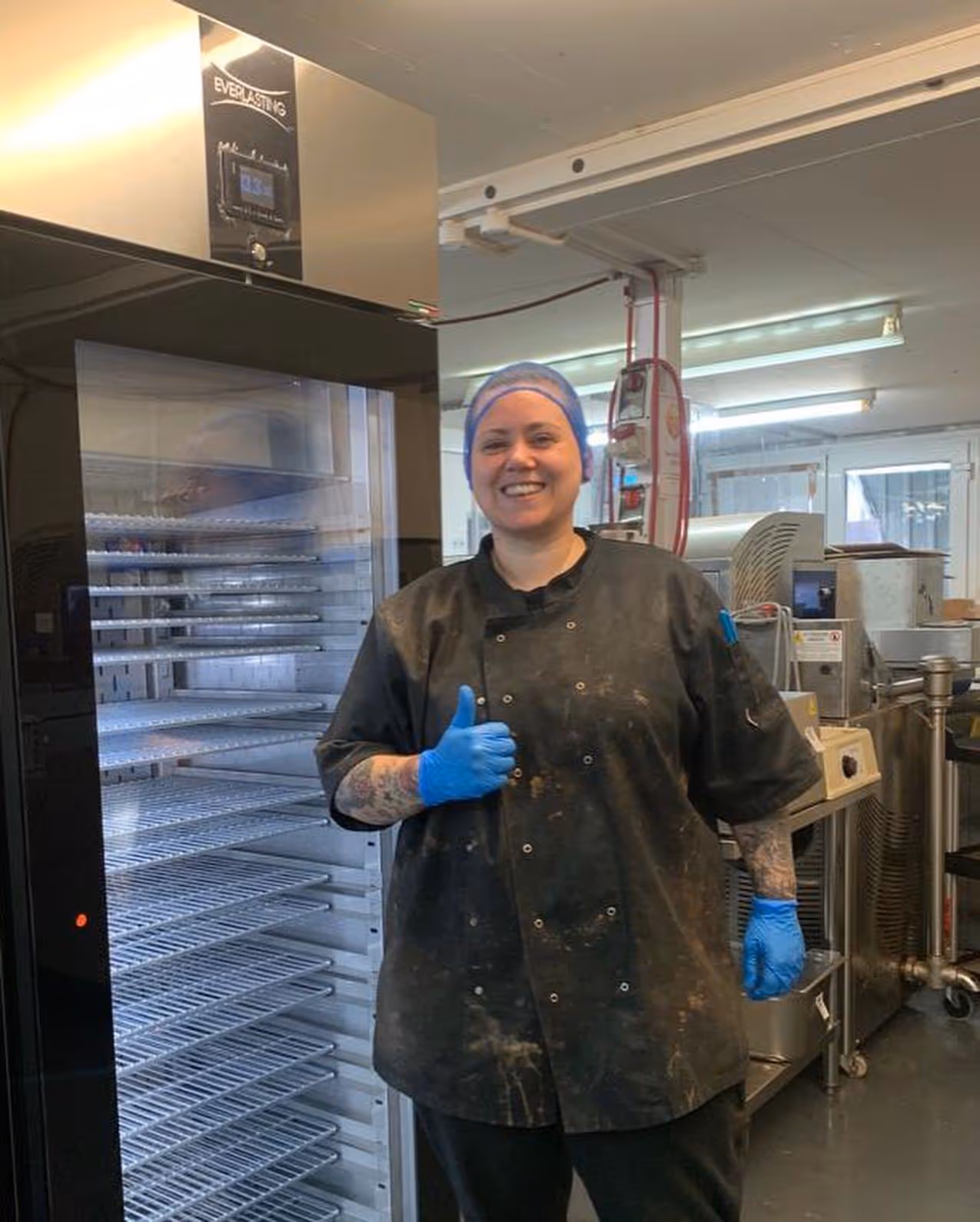 Happy Customer in front of refrigerator