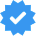Blue verified check mark badge with a pointed star shape.