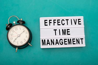 Alarm with a sign that says "Effective Time Management"